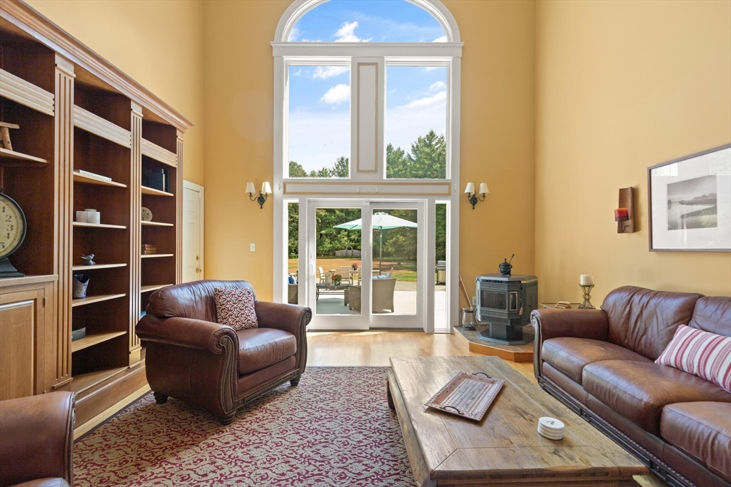 26 Cross Road Boxford, MA 01921 - Photo 5 of 41 a living room with furniture and a large window