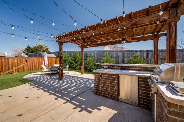 a view of a backyard with sitting area