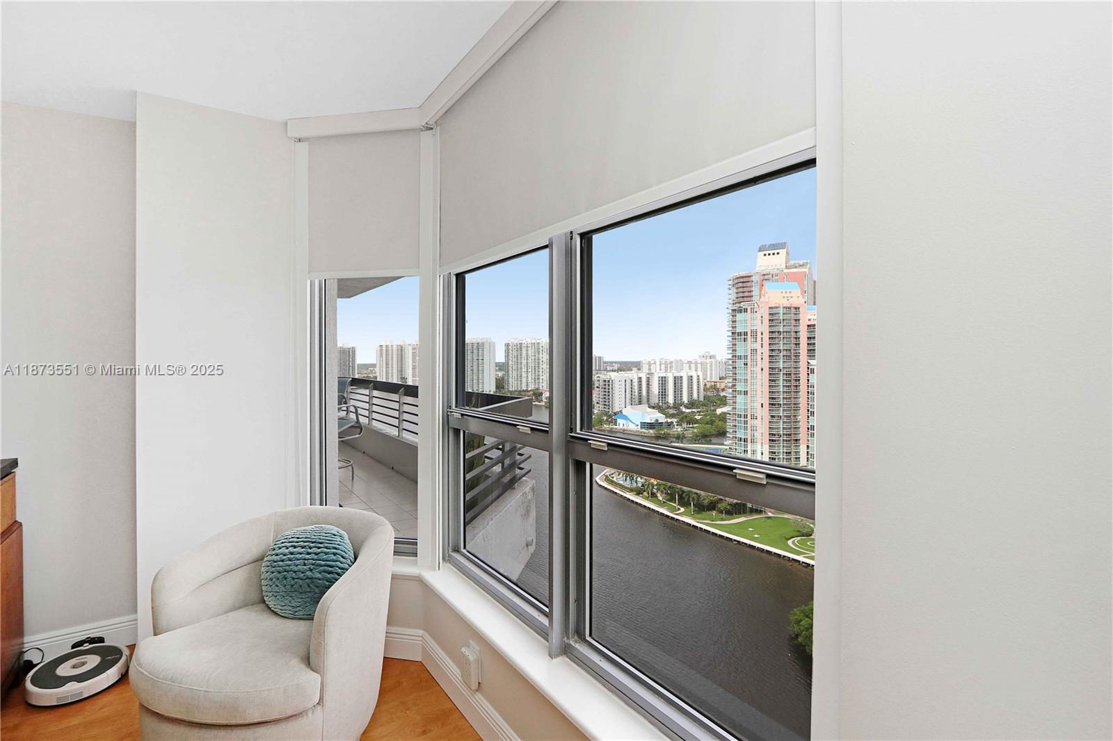 3530 Mystic Pointe Drive, Unit 2402 Aventura, FL 33180 - Photo 26 of 33 a kitchen with a refrigerator and a view of living room