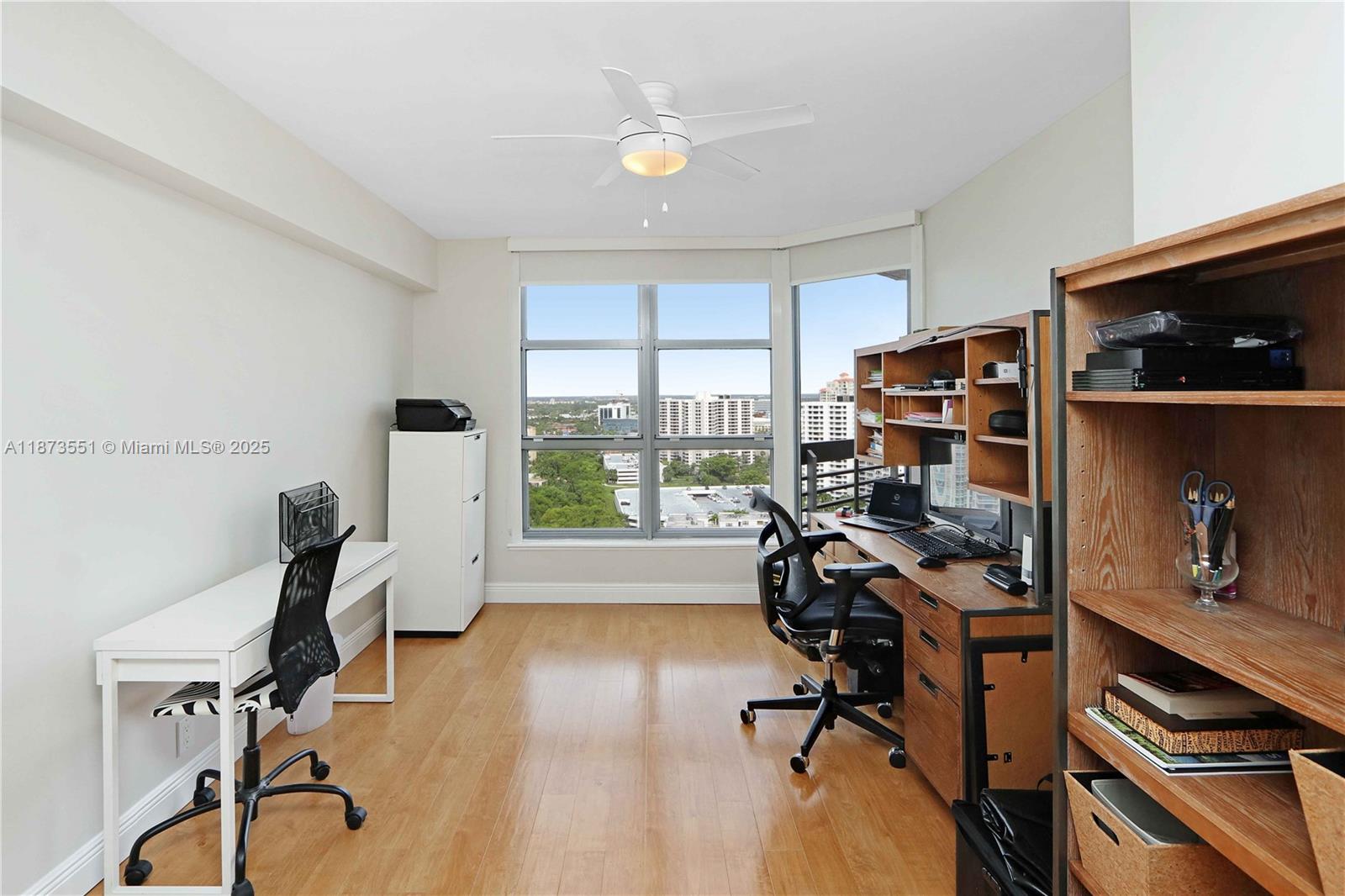 3530 Mystic Pointe Drive, Unit 2402 Aventura, FL 33180 - Photo 7 of 33 a view of a workspace with furniture and a window