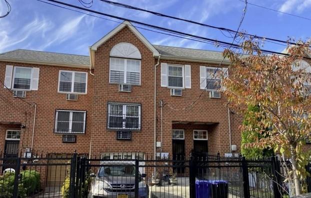 a front view of a house with glass windows