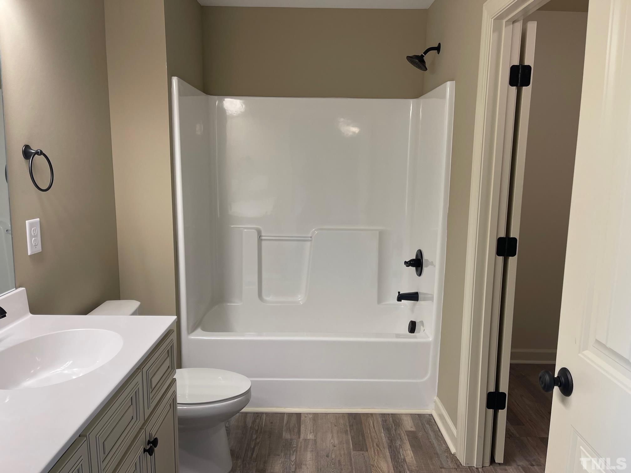 665 Bethel Church Road Angier, NC 27501 - Photo 20 of 32 a bathroom with a sink a toilet and shower