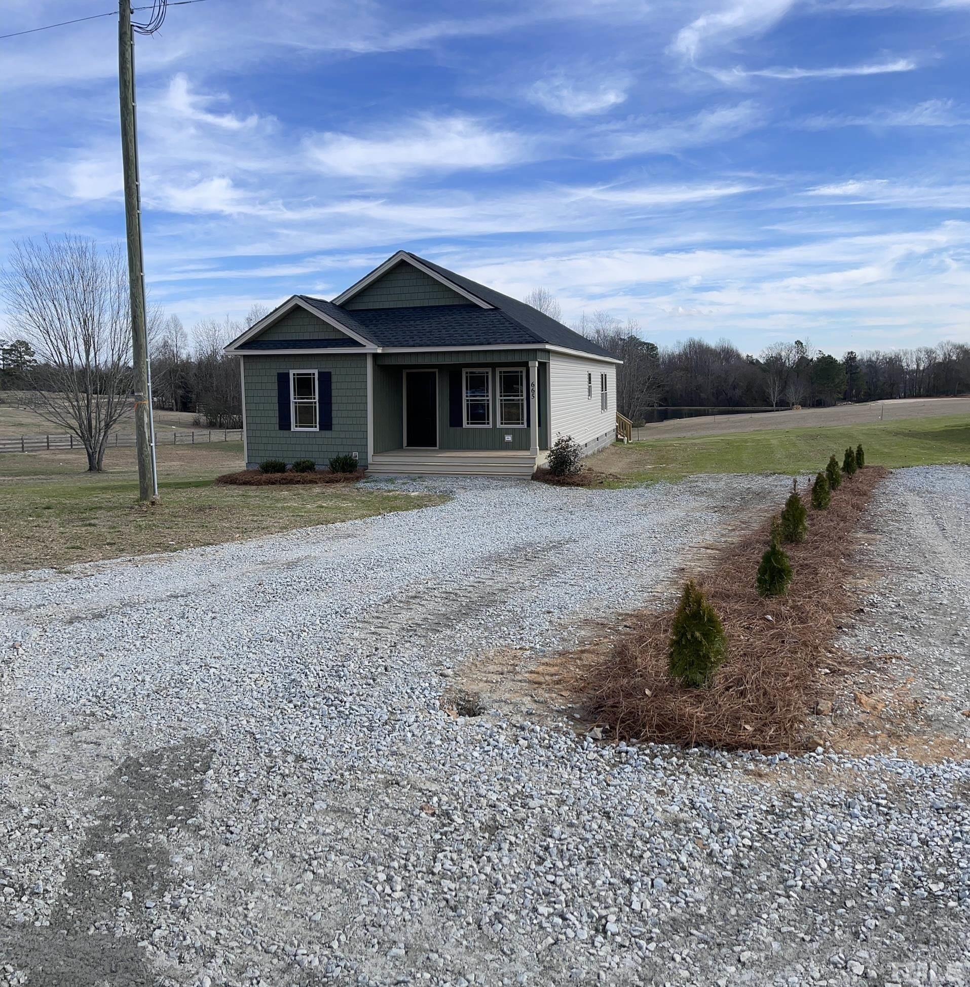 665 Bethel Church Road Angier, NC 27501 - Photo 2 of 32 a front view of a house with a yard