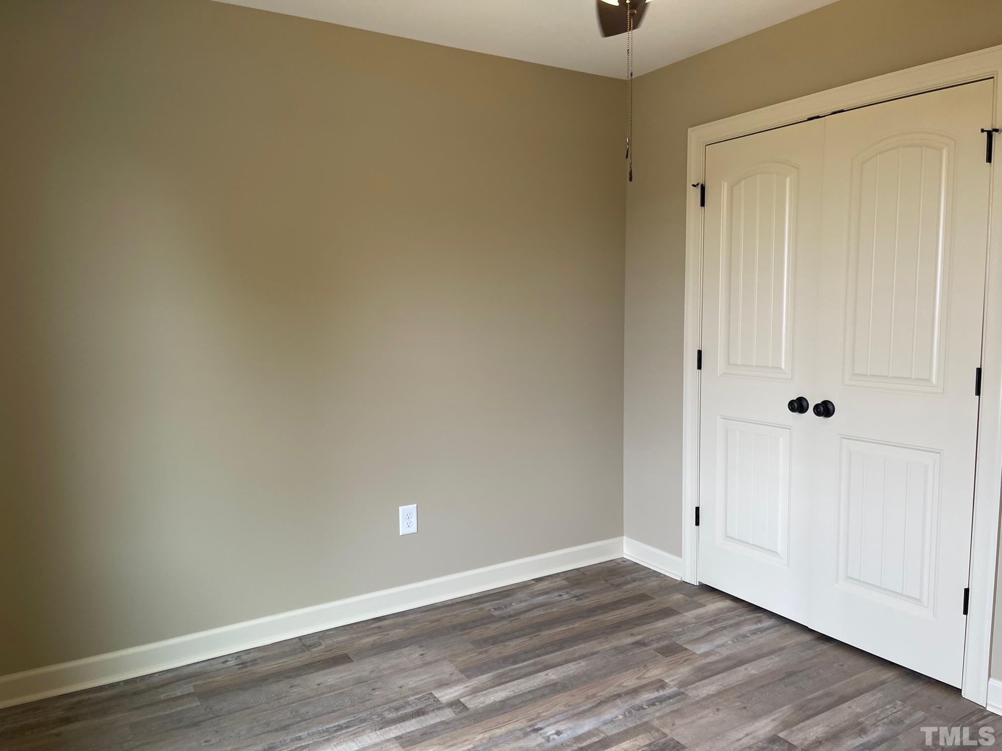 665 Bethel Church Road Angier, NC 27501 - Photo 28 of 32 a view of an empty room and wooden floor