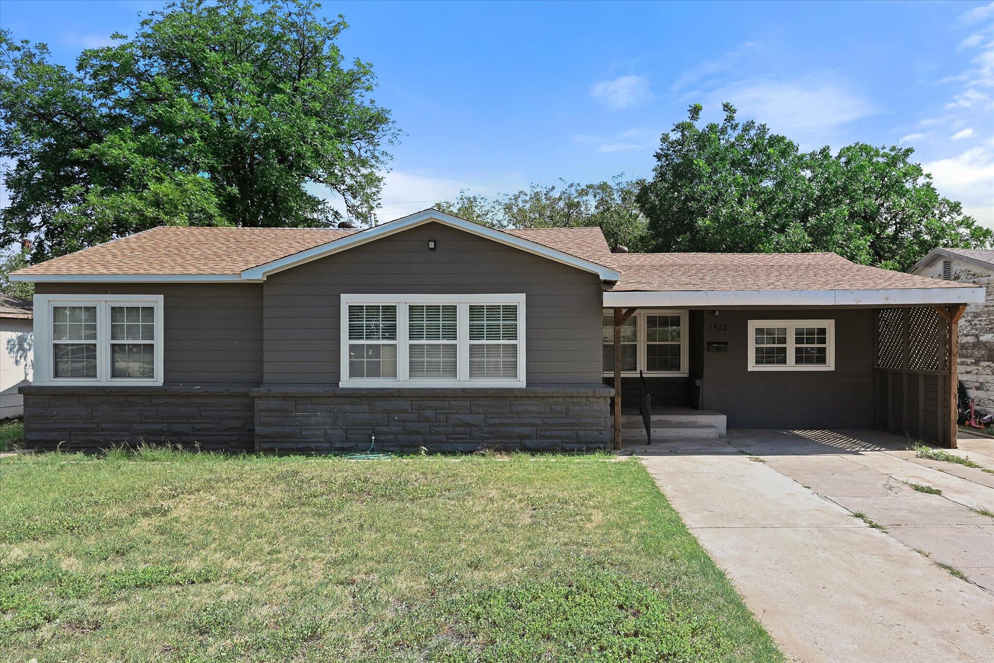 front view of a house with a yard