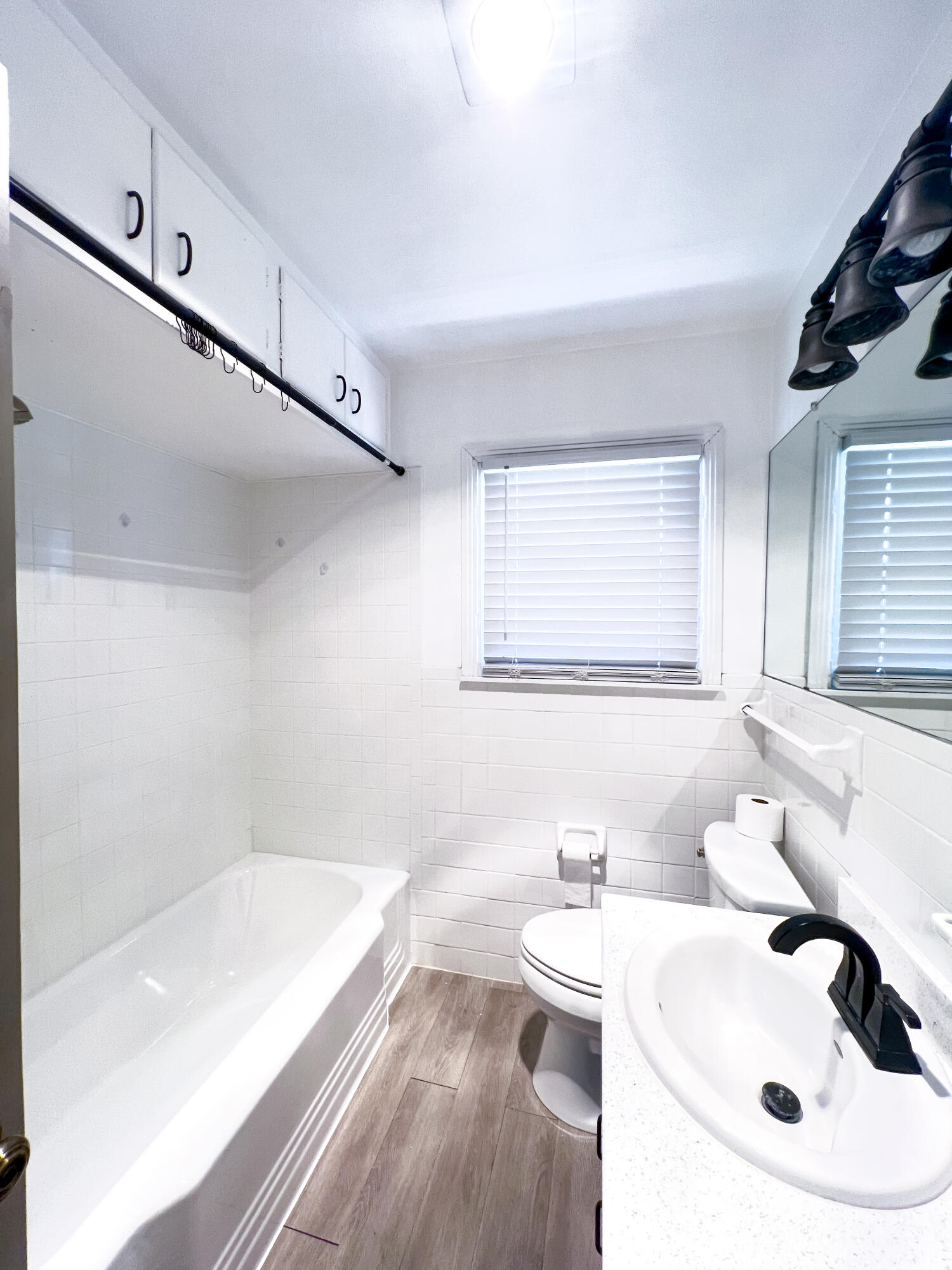 1513 37th Street Lubbock, TX 79412 - Photo 22 of 34 a bathroom with a sink and a bathtub
