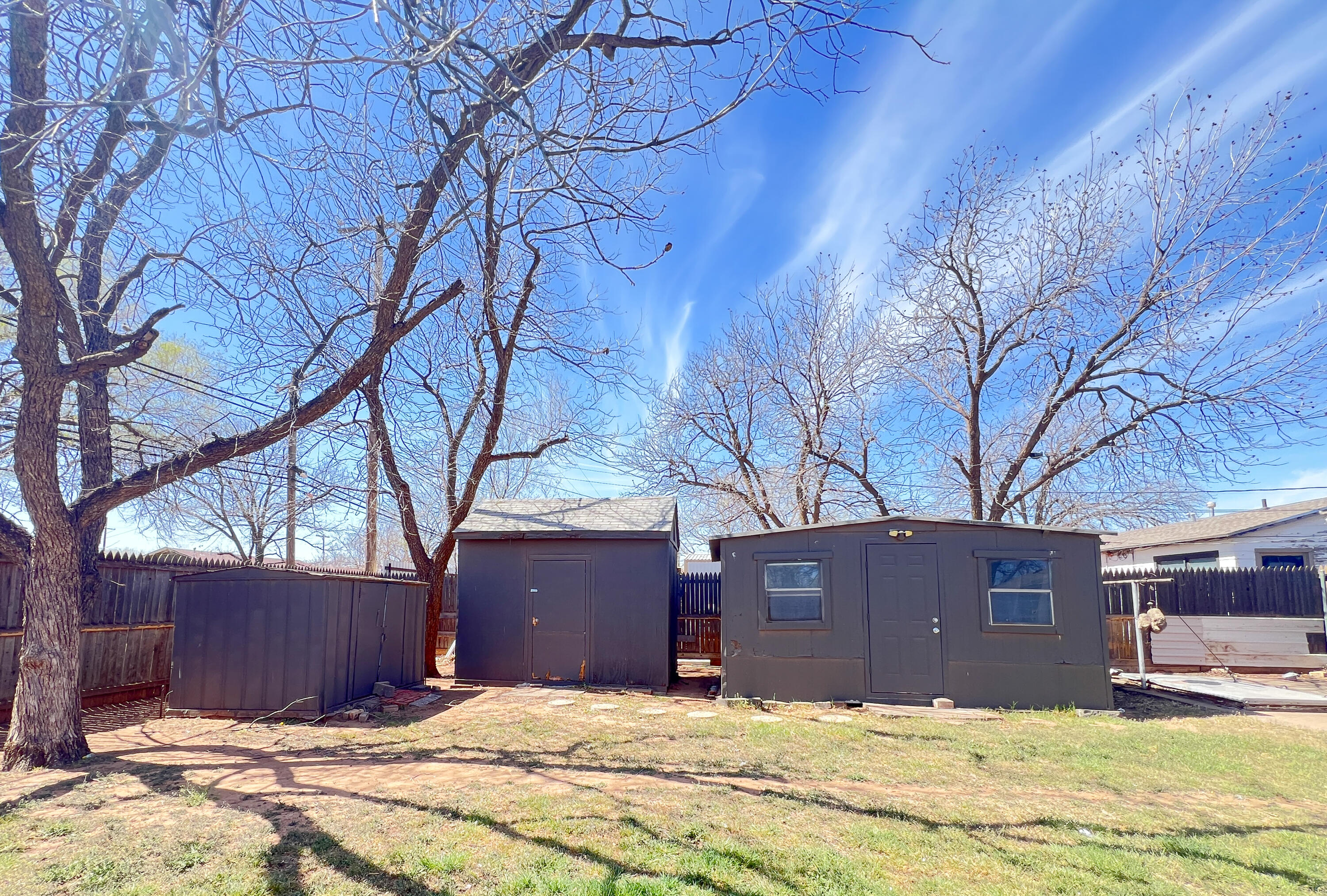 1513 37th Street Lubbock, TX 79412 - Photo 27 of 34 a view of a house with a yard