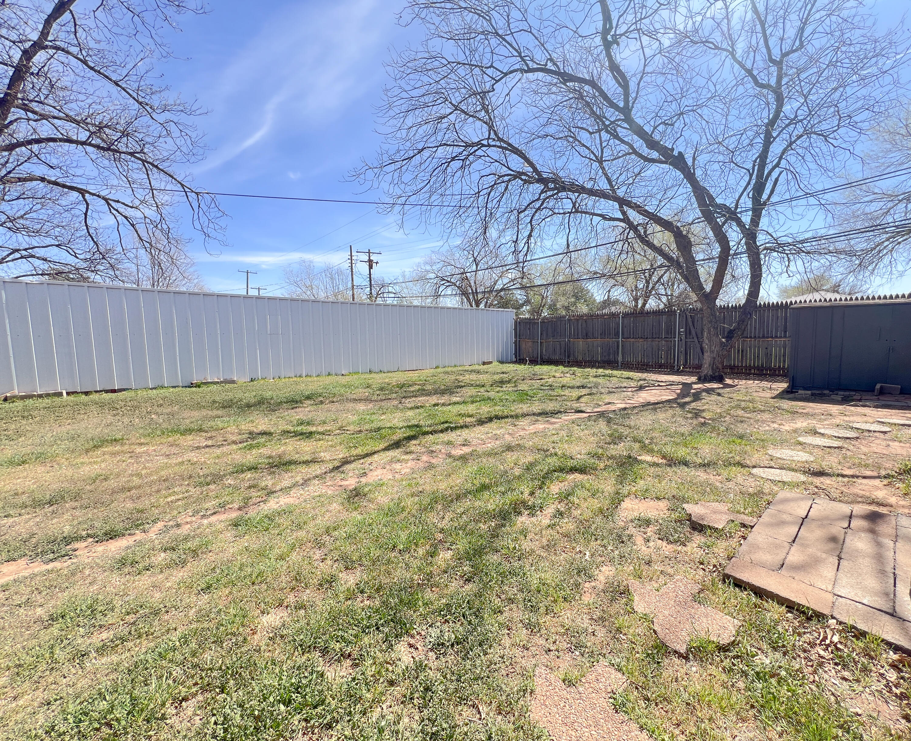 1513 37th Street Lubbock, TX 79412 - Photo 28 of 34 a view of swimming pool with an outdoor space and seating area