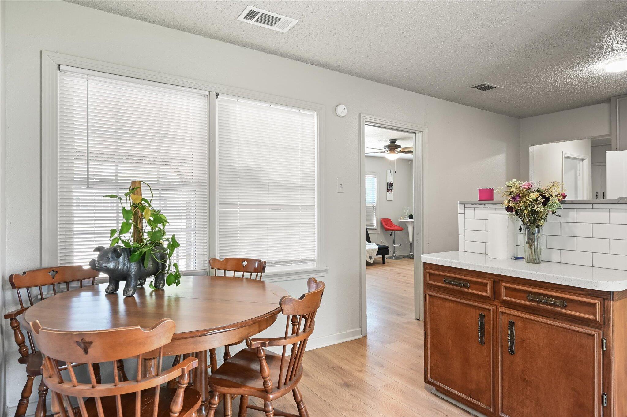 1513 37th Street Lubbock, TX 79412 - Photo 8 of 34 a dining room with furniture and window