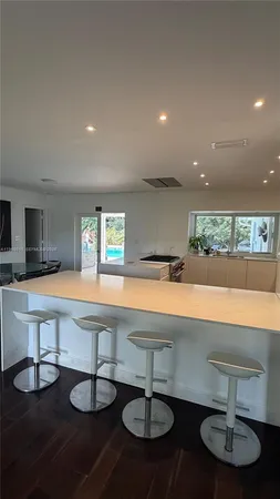 a room with lots of furniture and a chandelier