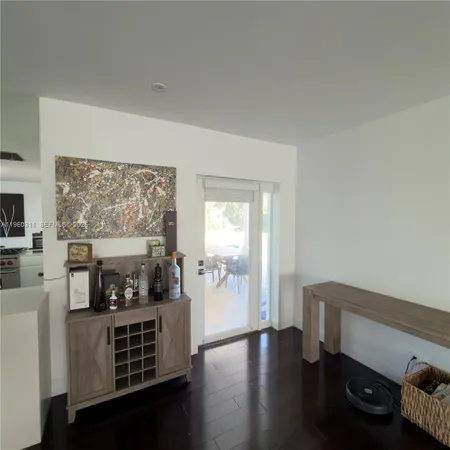 a living room with furniture fireplace and a window