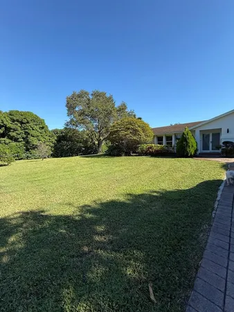 a view of a lake with a big yard