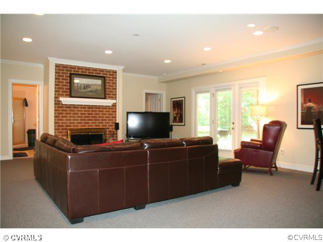 3931 Reeds Landing Circle Midlothian, VA 23113 - Photo 11 of 12 a living room with furniture and a flat screen tv