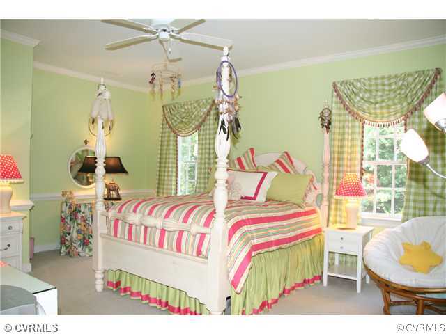 3931 Reeds Landing Circle Midlothian, VA 23113 - Photo 10 of 12 a bedroom with a bed and a chandelier