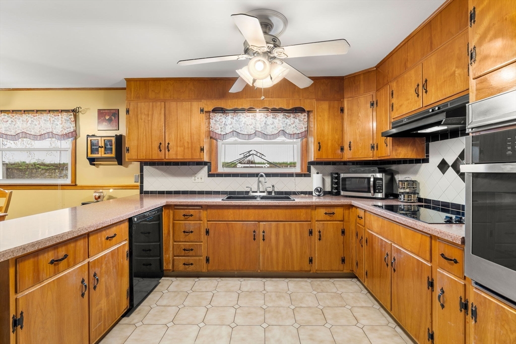 8 Agnes Terrace Methuen, MA 01844 - Photo 12 of 41 a large kitchen with stainless steel appliances granite countertop a sink and cabinets