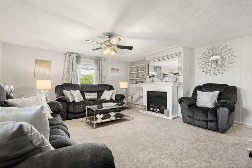 8 Agnes Terrace Methuen, MA 01844 - Photo 14 of 41 a living room with furniture and a fireplace