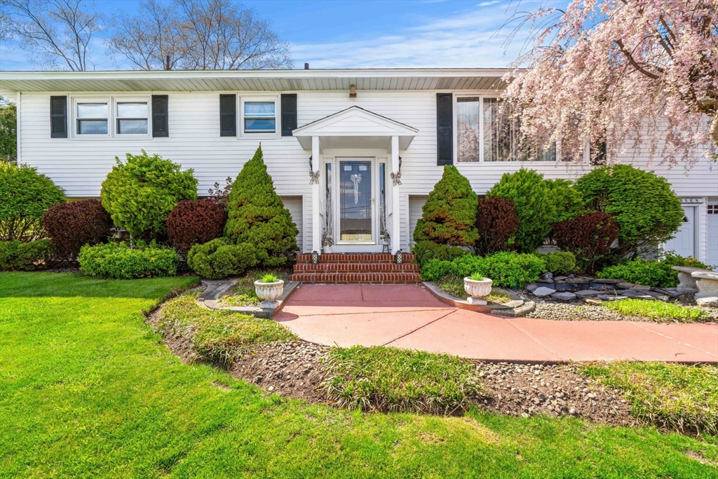 8 Agnes Terrace Methuen, MA 01844 - Photo 2 of 41 front view of a house with a yard