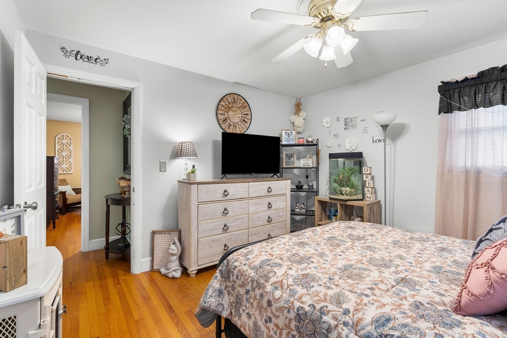 8 Agnes Terrace Methuen, MA 01844 - Photo 21 of 41 a bedroom with a bed and a flat tv screen on dresser