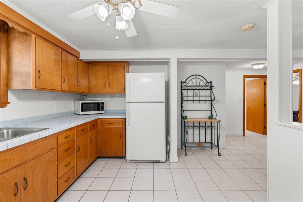 8 Agnes Terrace Methuen, MA 01844 - Photo 28 of 41 a kitchen with stainless steel appliances granite countertop a refrigerator and a sink
