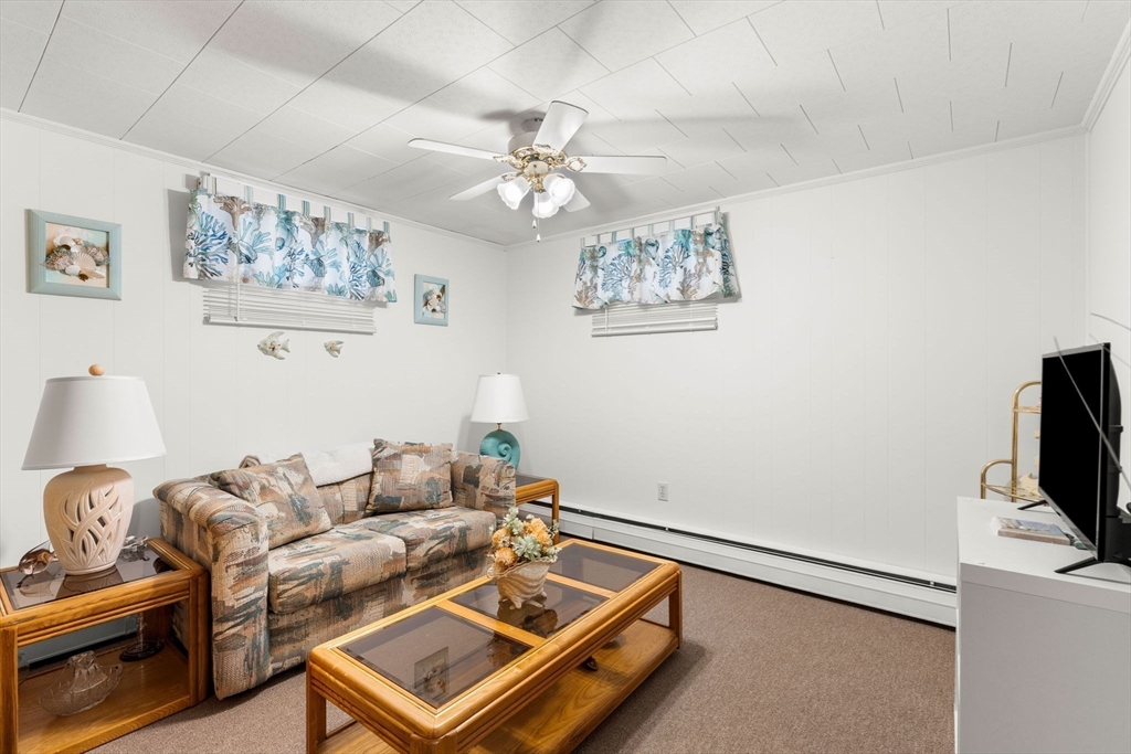 8 Agnes Terrace Methuen, MA 01844 - Photo 32 of 41 a living room with furniture and a flat screen tv