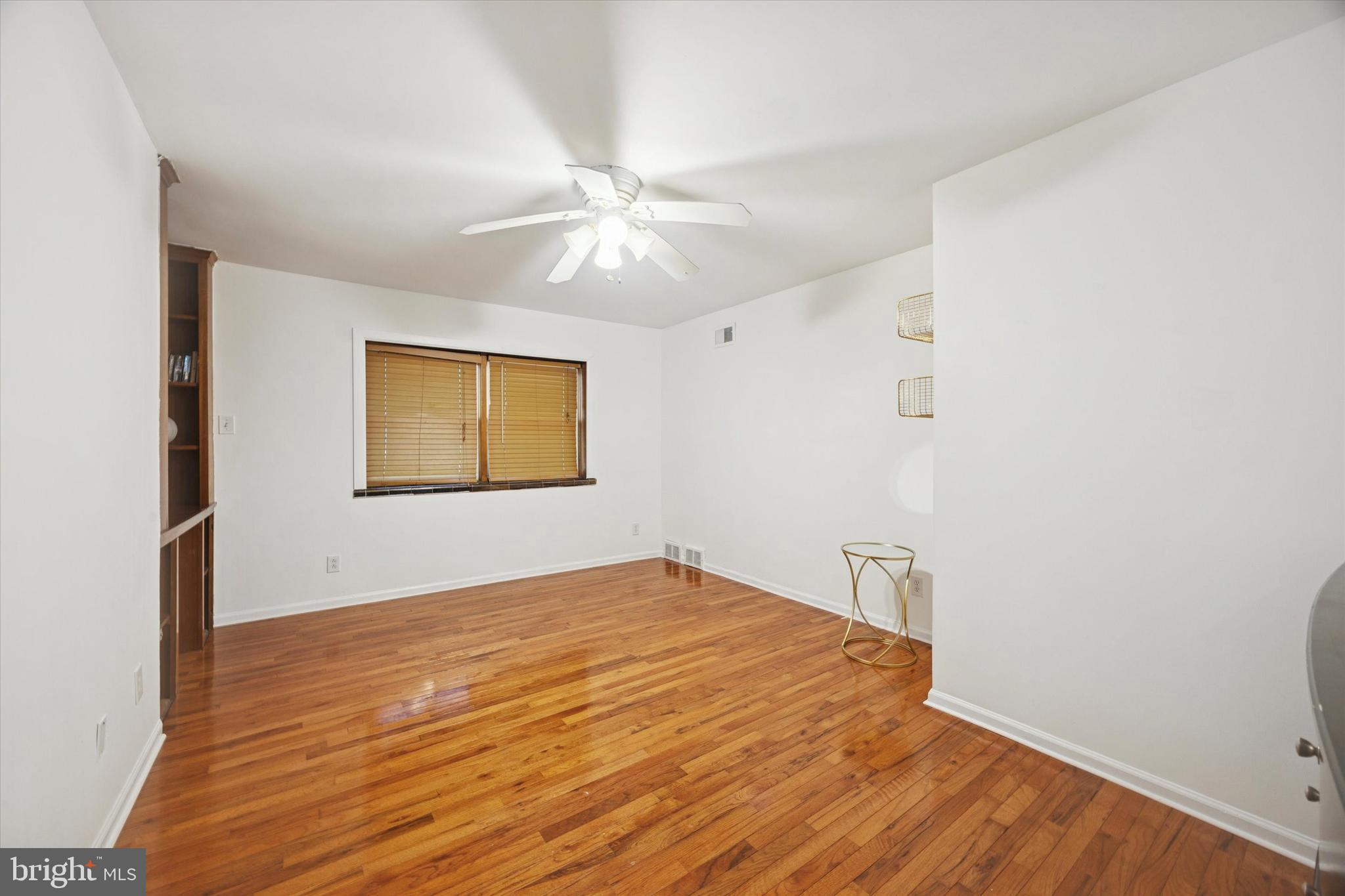 7033 Sherwood Road Philadelphia, PA 19151 - Photo 11 of 16 a view of an empty room with a window