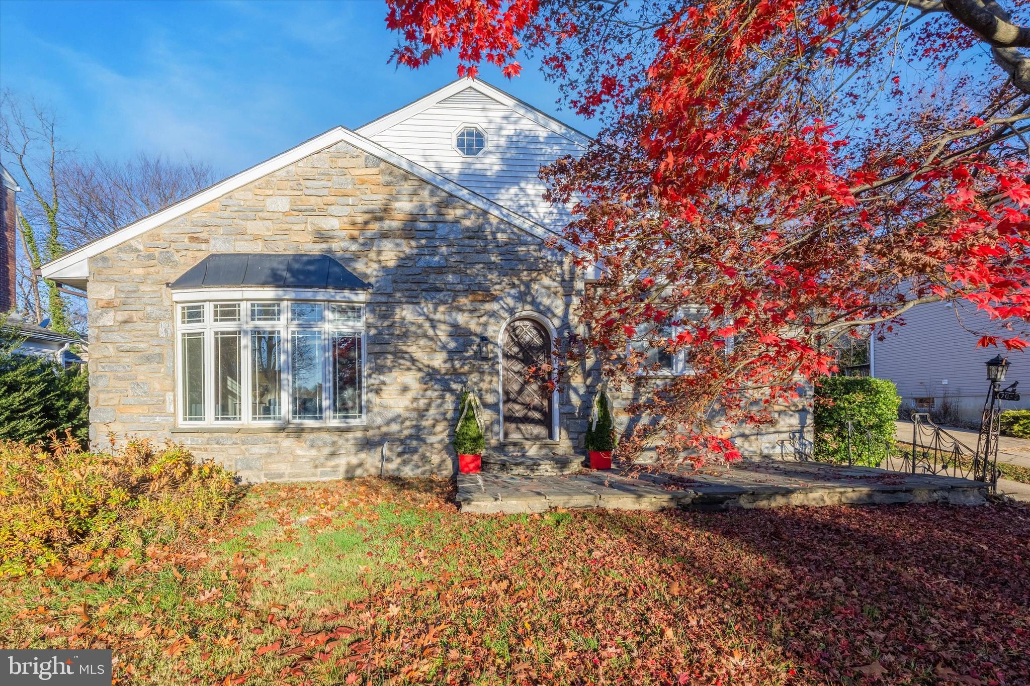 7033 Sherwood Road Philadelphia, PA 19151 - Photo 2 of 16 a front view of a house with a yard