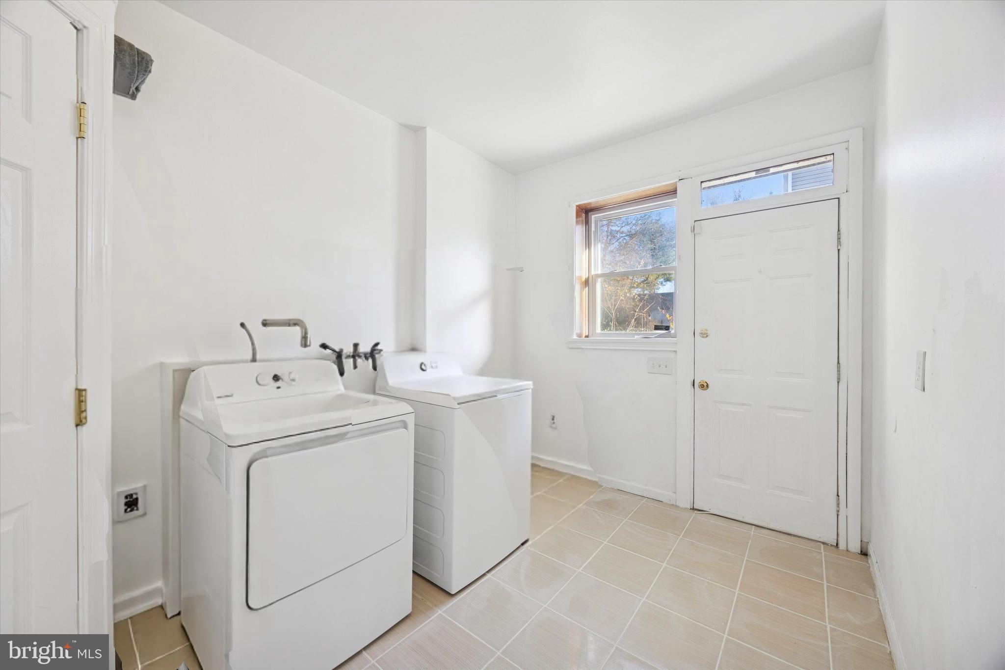 7033 Sherwood Road Philadelphia, PA 19151 - Photo 8 of 16 a utility room with dryer and washer