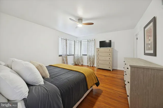 a bedroom with a bed and a dresser