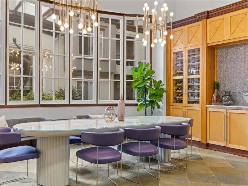 9237 Regents Road, Unit K101 La Jolla, CA 92037 - Photo 27 of 29 a dining room with furniture a window and a kitchen view