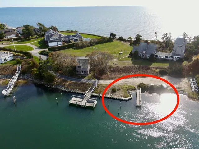 an aerial view of a house with a swimming pool yard and outdoor seating
