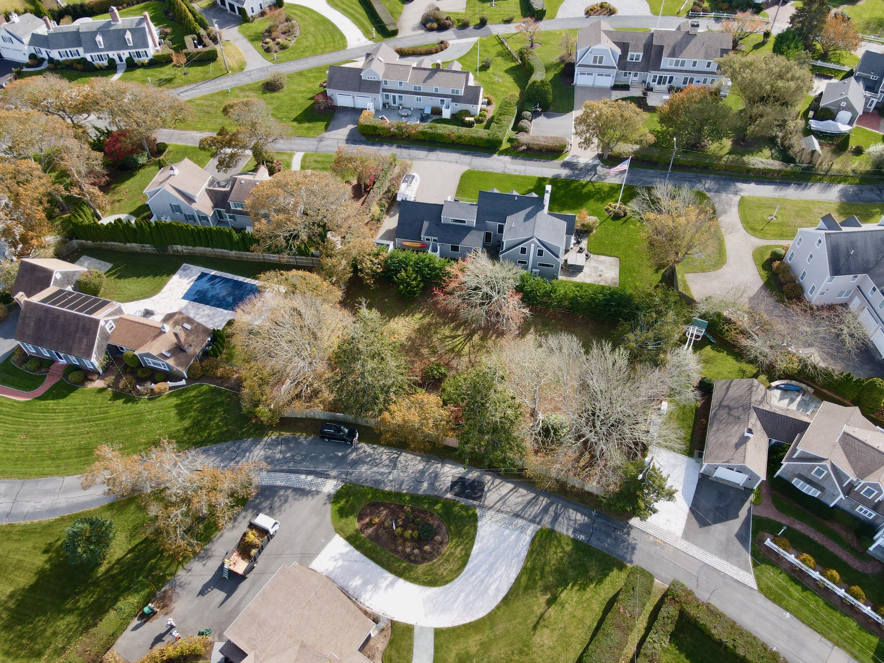 19 Riverway West Harwich, MA 02671 - Photo 6 of 15 a aerial view of a house with a yard and lake view