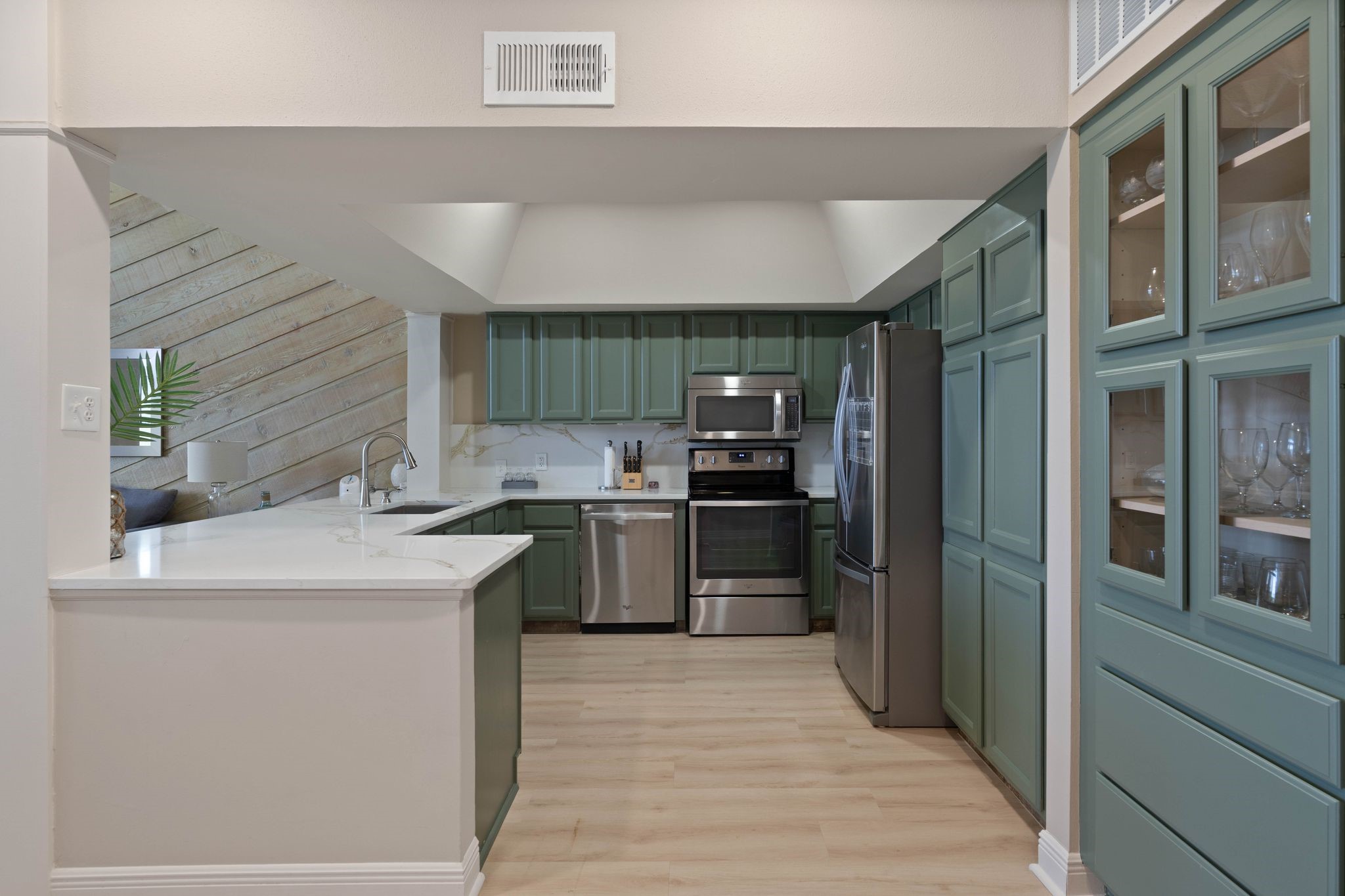 68 April Point Drive South, Unit E68 Conroe, TX 77356 - Photo 13 of 46 a kitchen with stainless steel appliances granite countertop a refrigerator and a sink