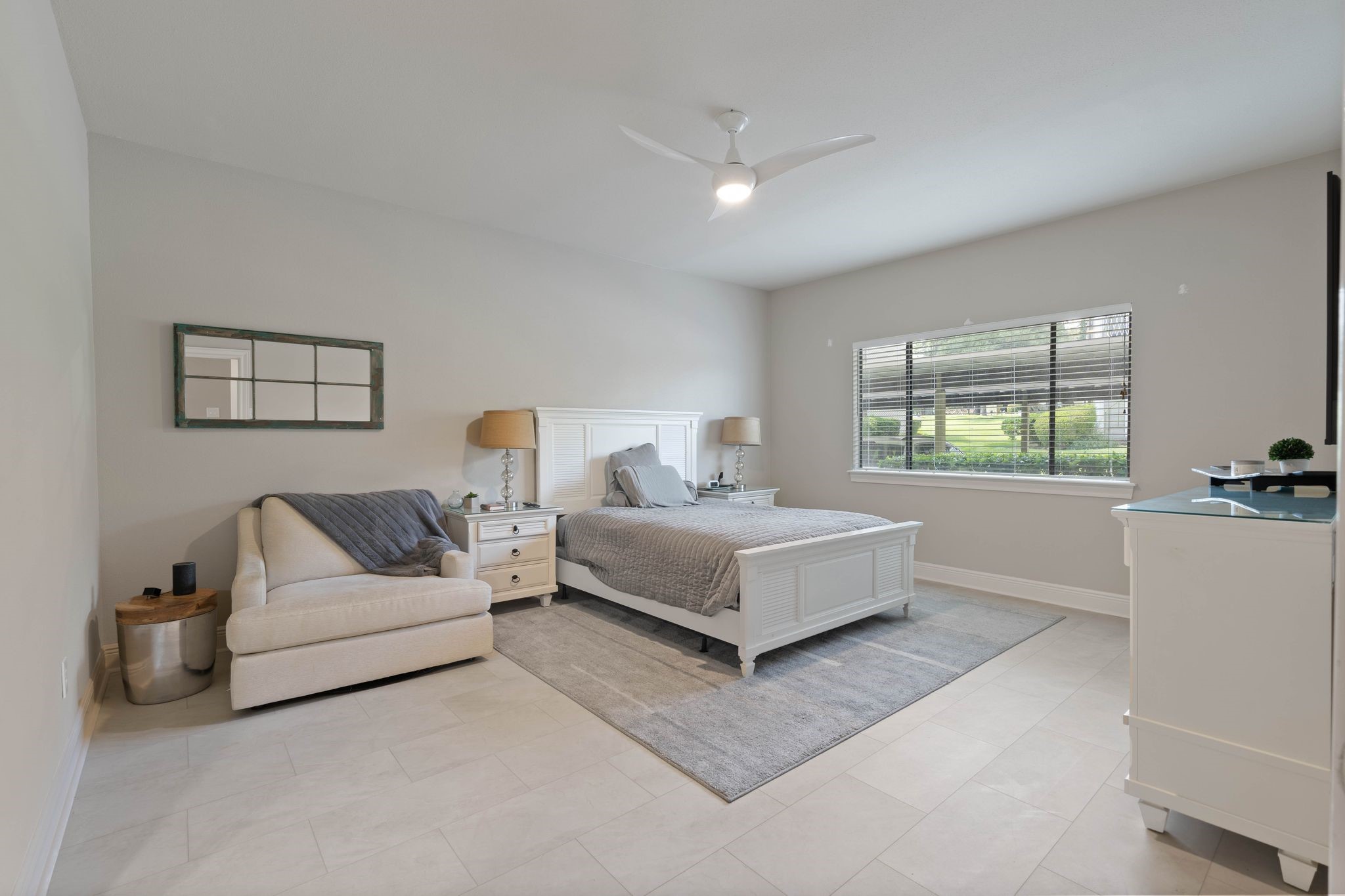 68 April Point Drive South, Unit E68 Conroe, TX 77356 - Photo 18 of 46 a living room with furniture and a large window