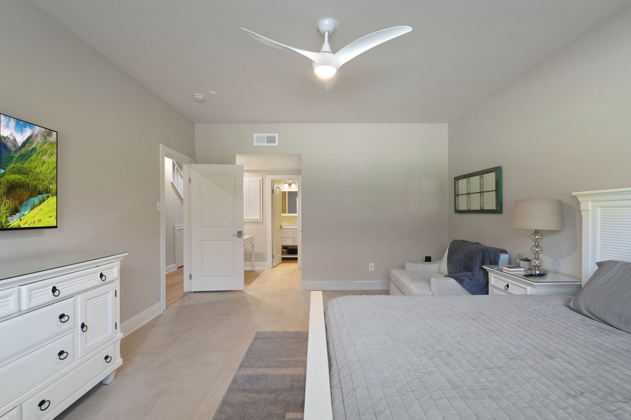 68 April Point Drive South, Unit E68 Conroe, TX 77356 - Photo 19 of 46 a bedroom with a bed and a cabinets