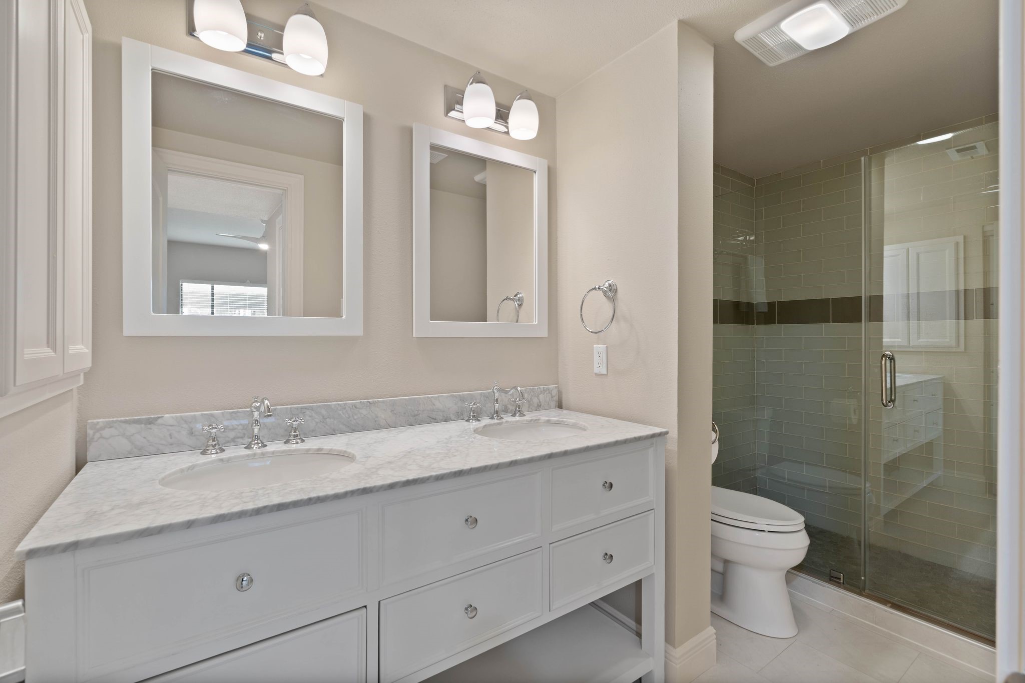 68 April Point Drive South, Unit E68 Conroe, TX 77356 - Photo 22 of 46 a bathroom with a granite countertop sink a toilet and shower