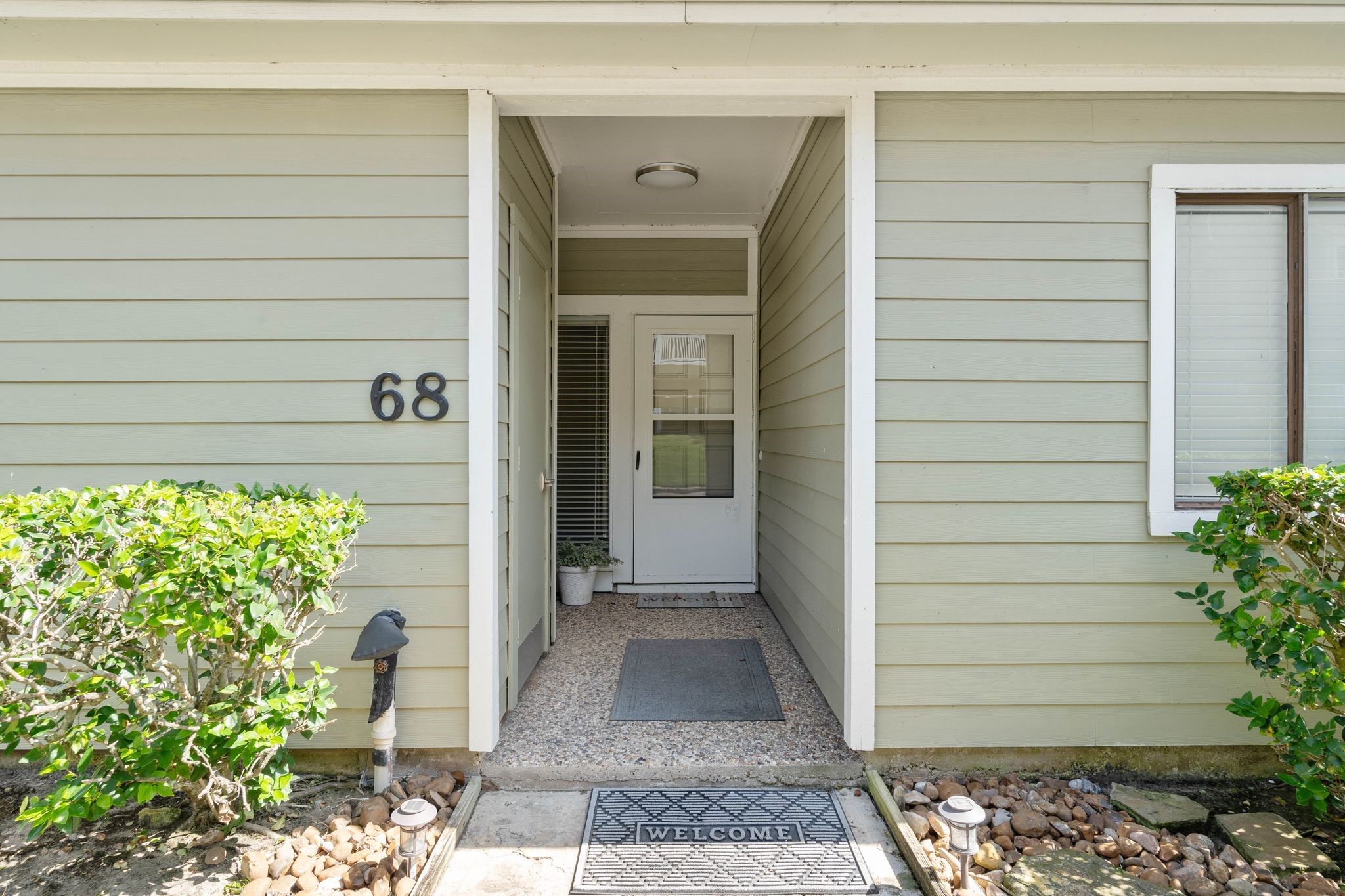 68 April Point Drive South, Unit E68 Conroe, TX 77356 - Photo 3 of 46 a view of front door of house