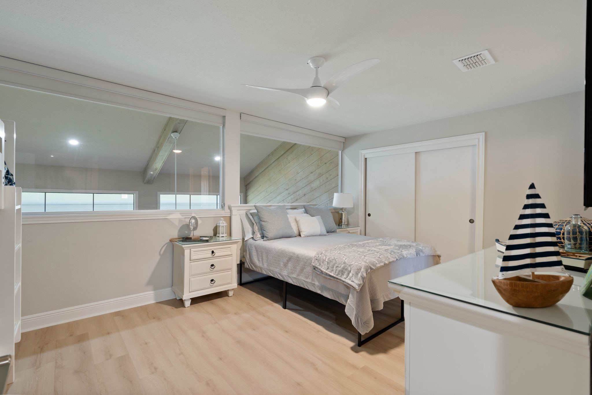 68 April Point Drive South, Unit E68 Conroe, TX 77356 - Photo 31 of 46 a bedroom with a bed and a walk in closet