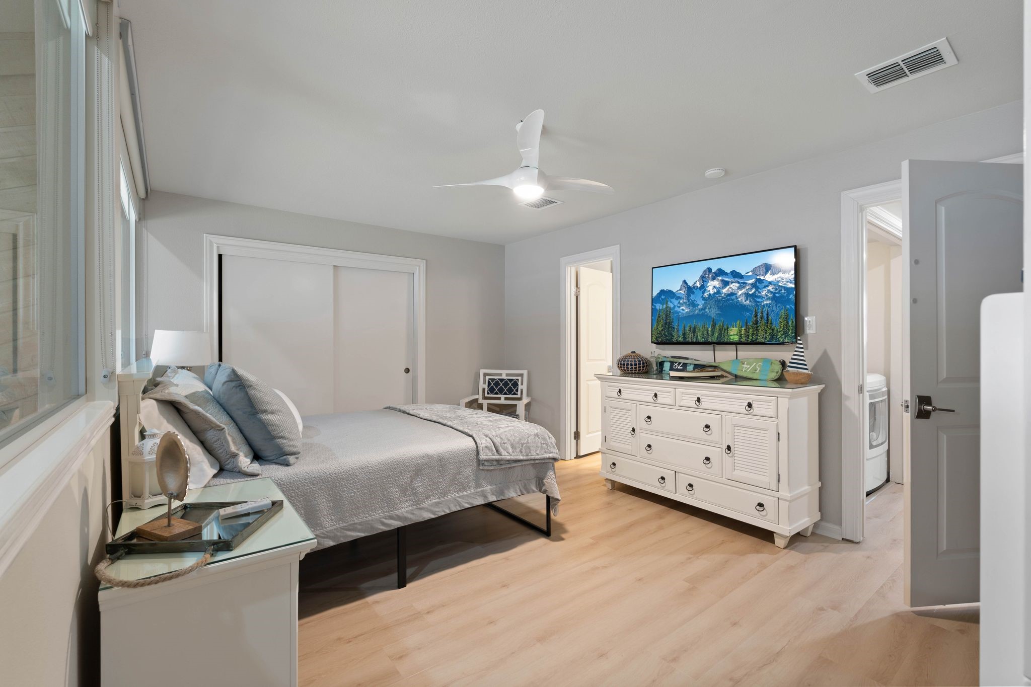 68 April Point Drive South, Unit E68 Conroe, TX 77356 - Photo 32 of 46 a bedroom with a bed and a flat screen tv