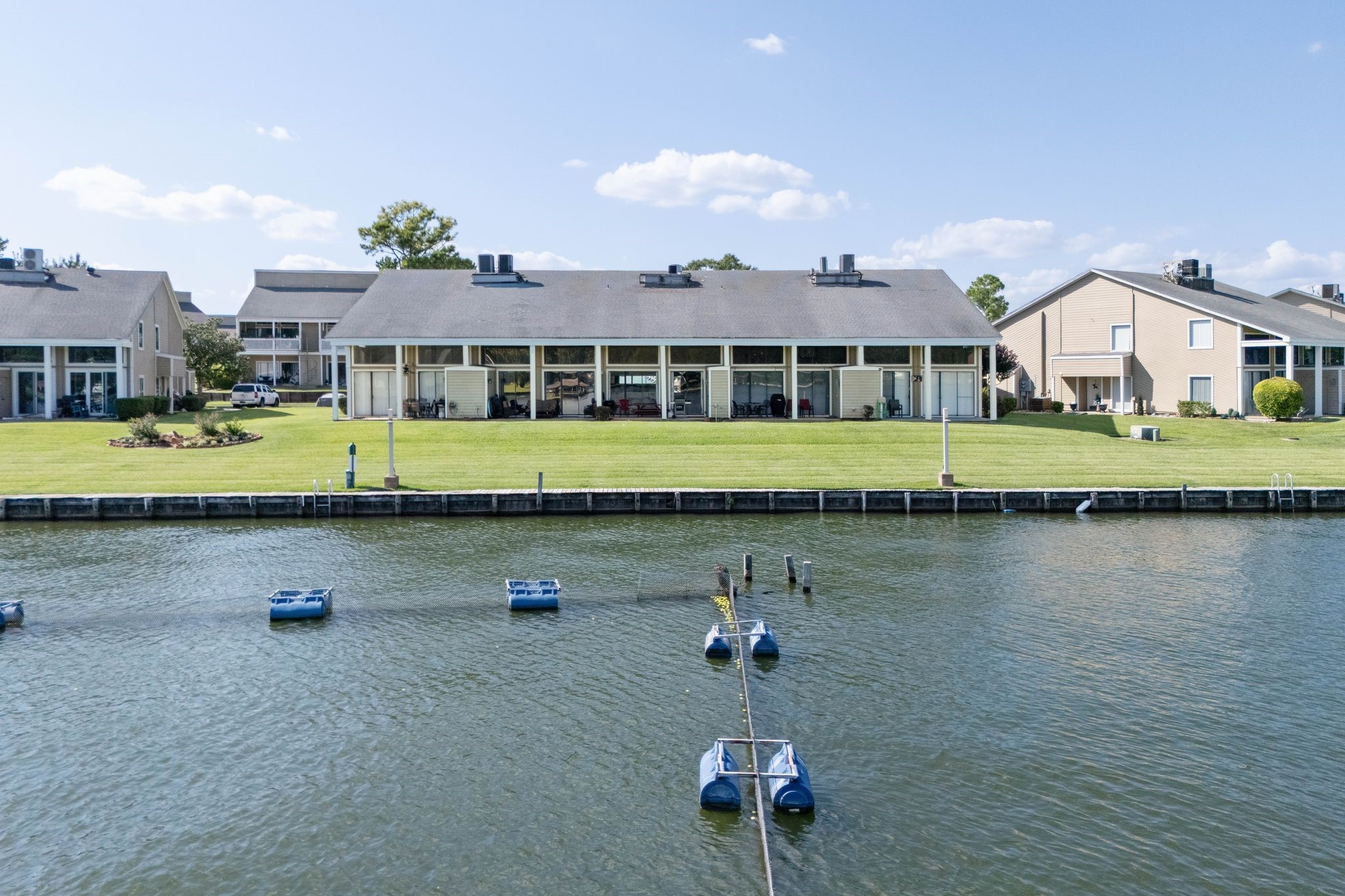 68 April Point Drive South, Unit E68 Conroe, TX 77356 - Photo 39 of 46 a view of a house with a lake view