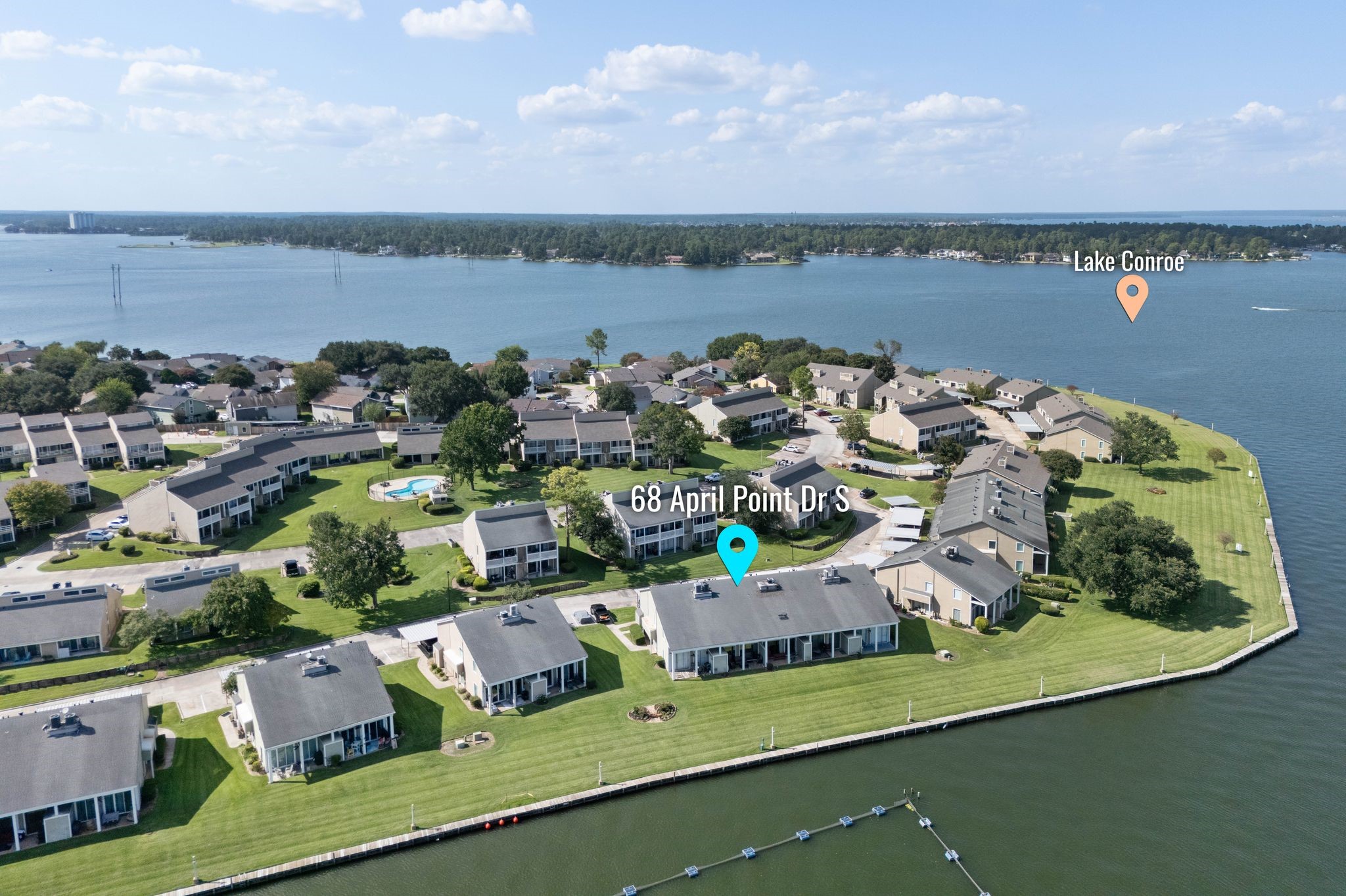 68 April Point Drive South, Unit E68 Conroe, TX 77356 - Photo 41 of 46 a view of a lake with a mountain view