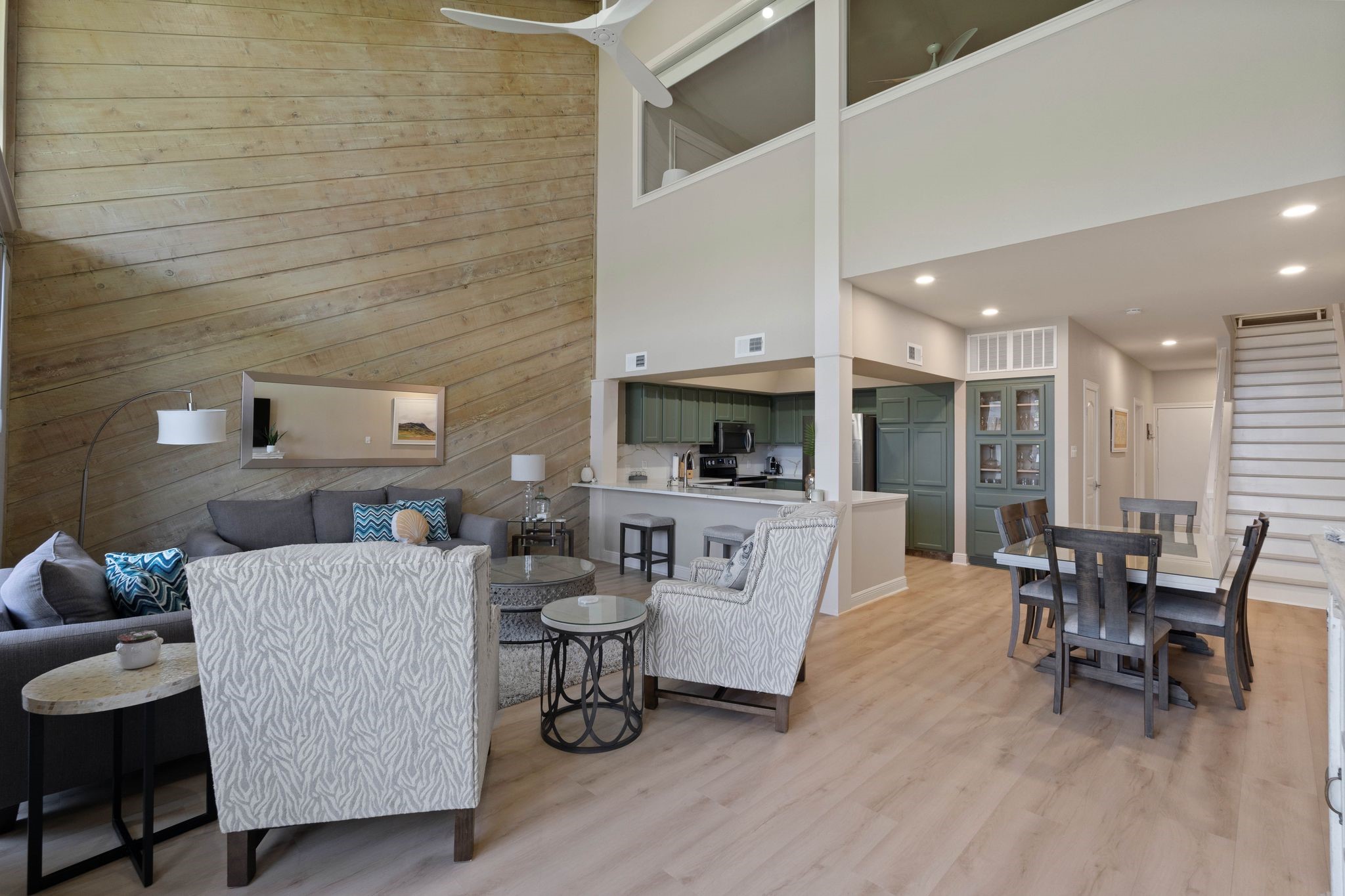 68 April Point Drive South, Unit E68 Conroe, TX 77356 - Photo 8 of 46 a living room with furniture and a wooden floor