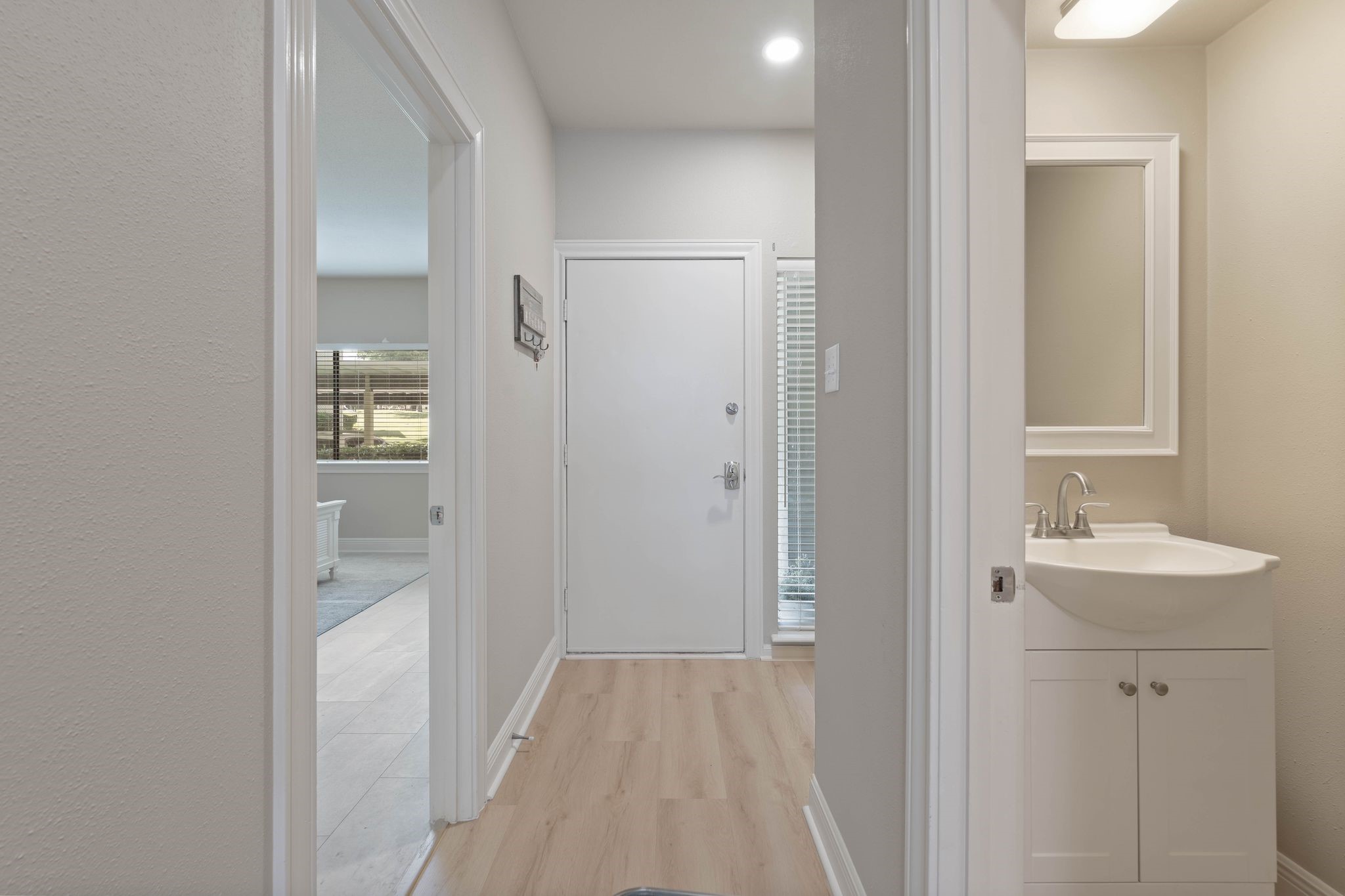 68 April Point Drive South, Unit E68 Conroe, TX 77356 - Photo 9 of 46 a bathroom with a sink and mirror