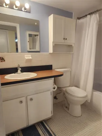 a bathroom with a sink toilet and vanity