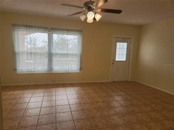 a view of an empty room with a window