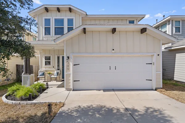 a front view of a house with garage