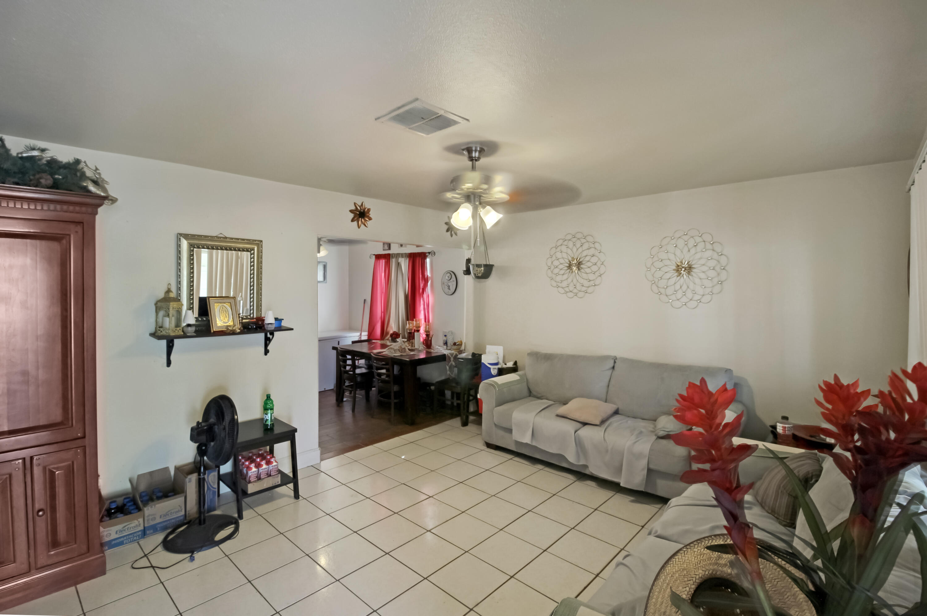 82321 Adobe Road Indio, CA 92201 - Photo 2 of 12 a living room with furniture and a chandelier