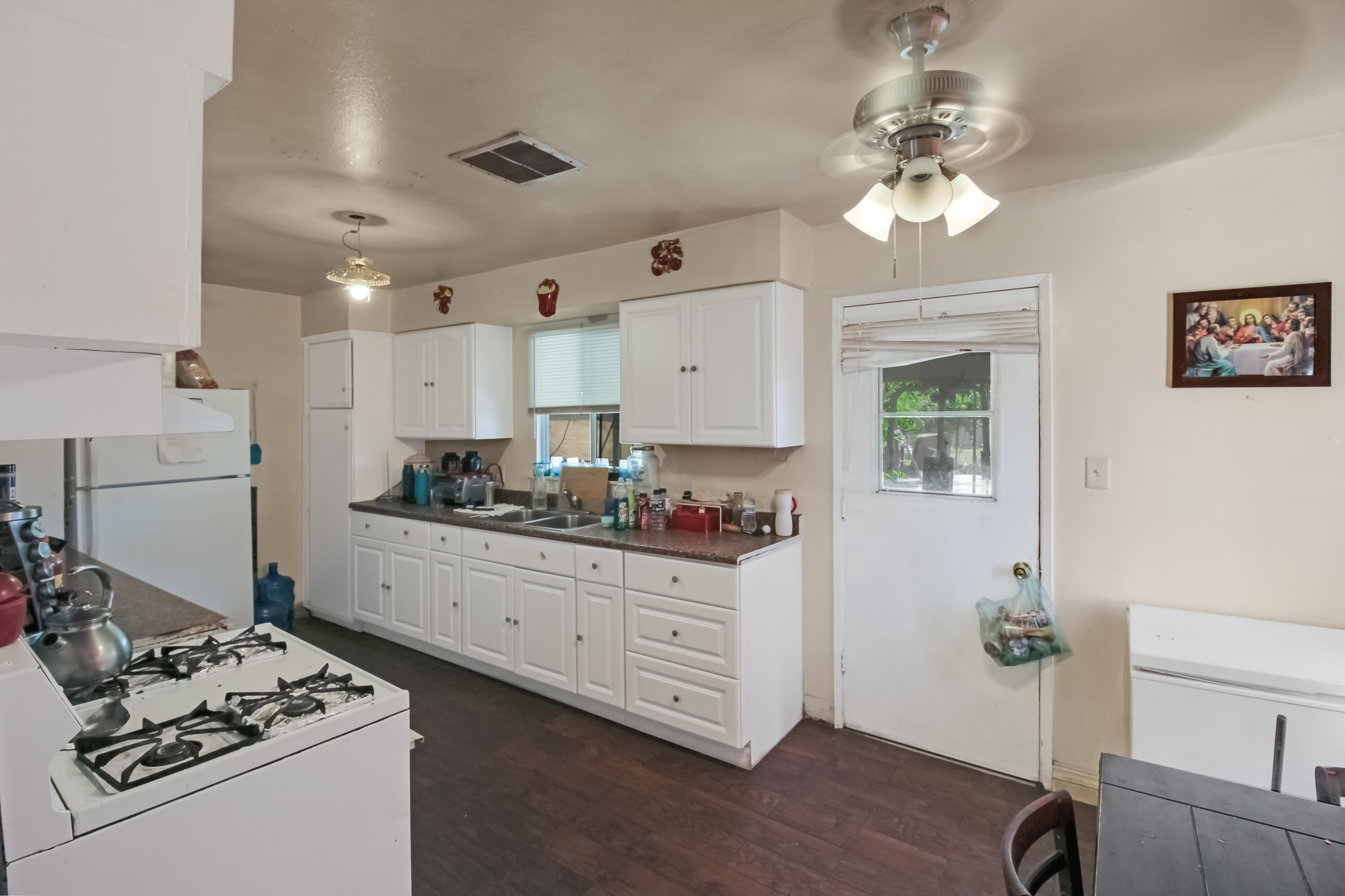 82321 Adobe Road Indio, CA 92201 - Photo 4 of 12 a kitchen with stainless steel appliances granite countertop a stove refrigerator and cabinets