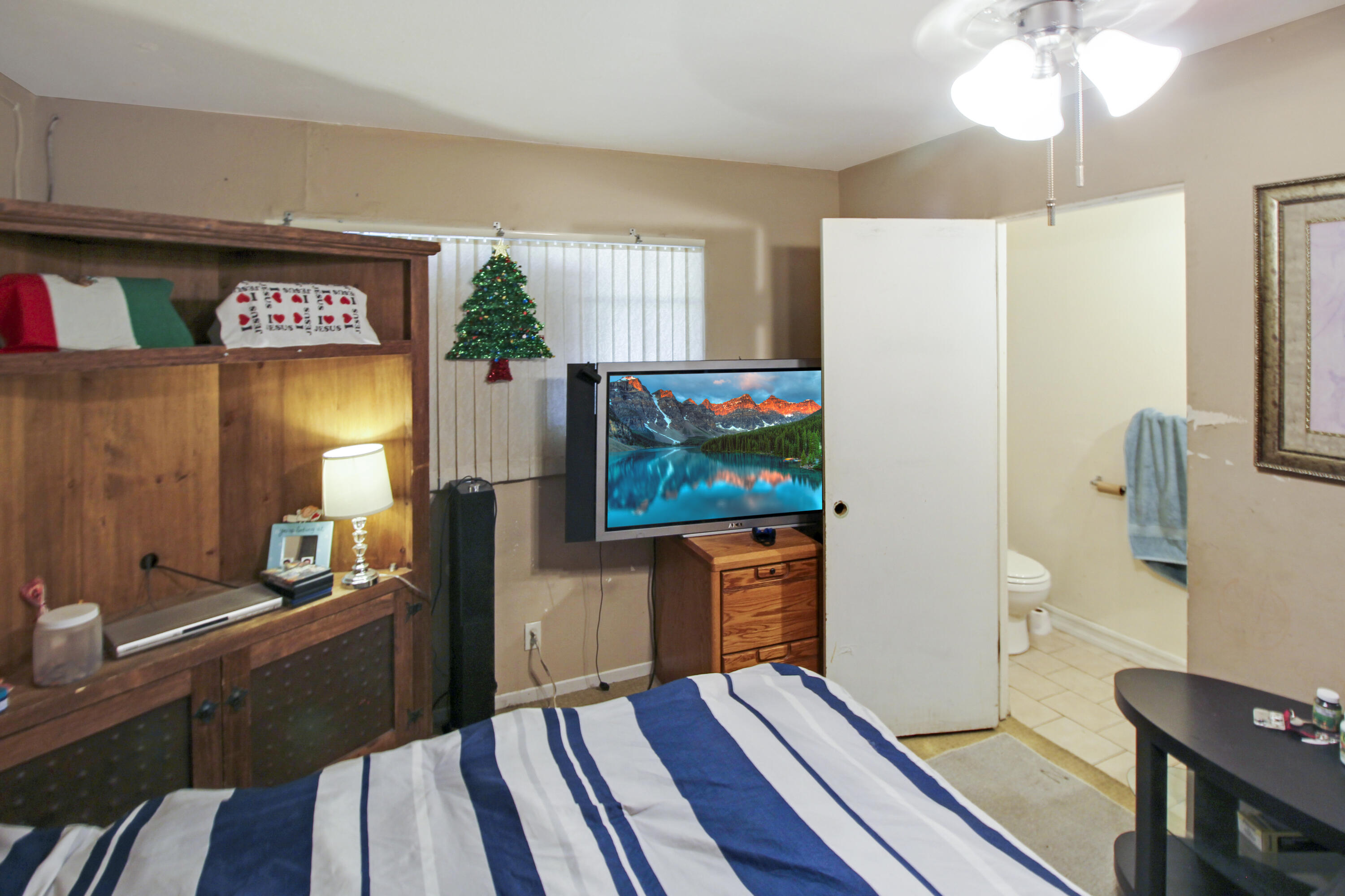 82321 Adobe Road Indio, CA 92201 - Photo 10 of 12 a living room with furniture and a flat screen tv