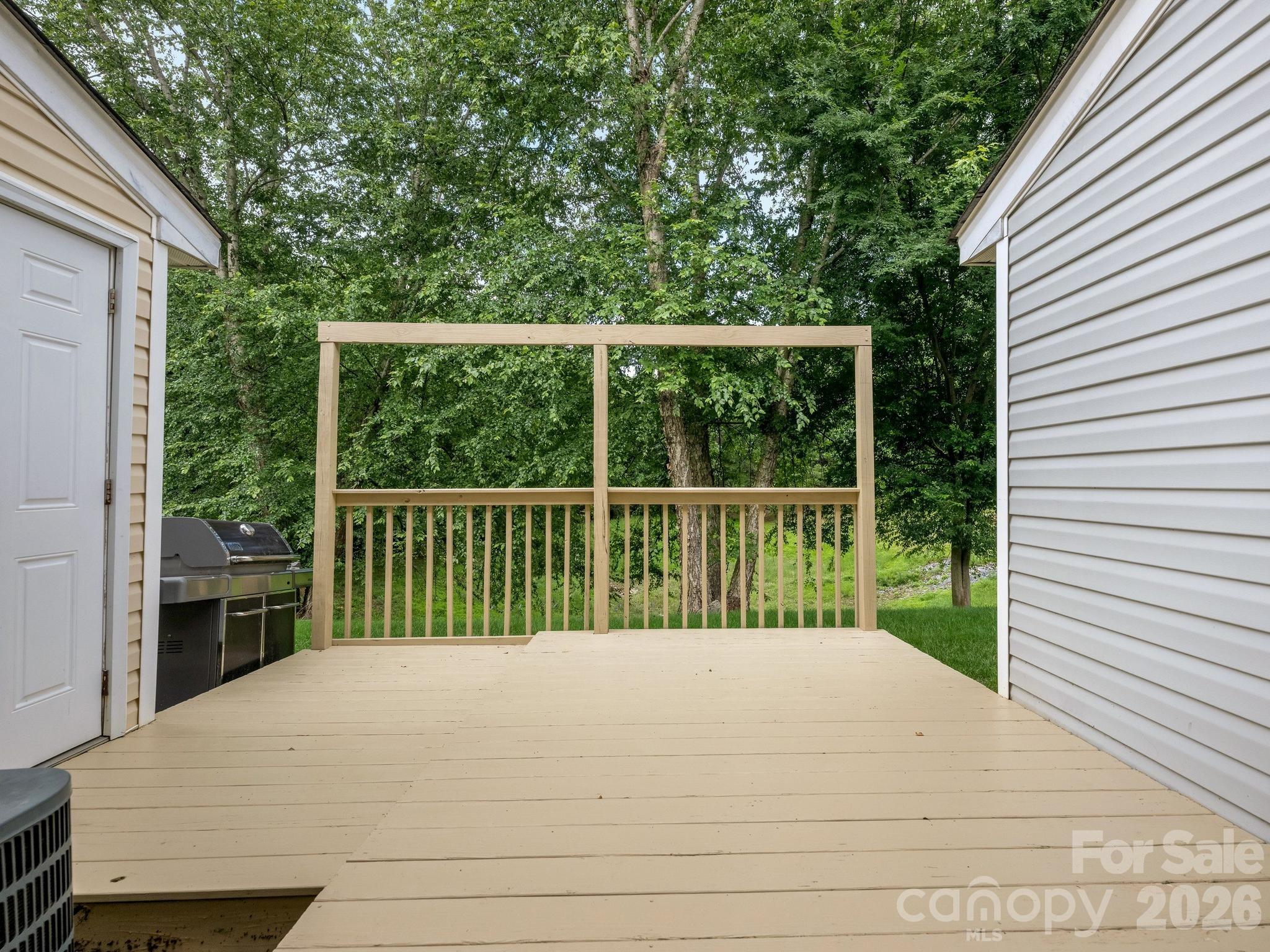 3259 Blythe Ridge Court Charlotte, NC 28213 - Photo 15 of 17 a view of backyard with a deck and a garden