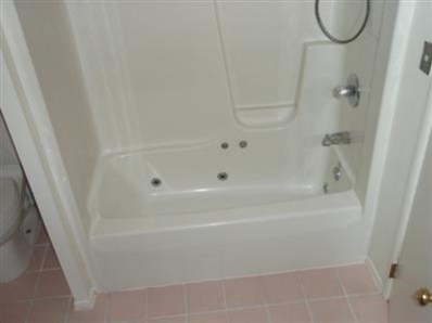 3744 Wirth Road Highland, IN 46322 - Photo 4 of 9 a close up view of a bathtub in a bathroom
